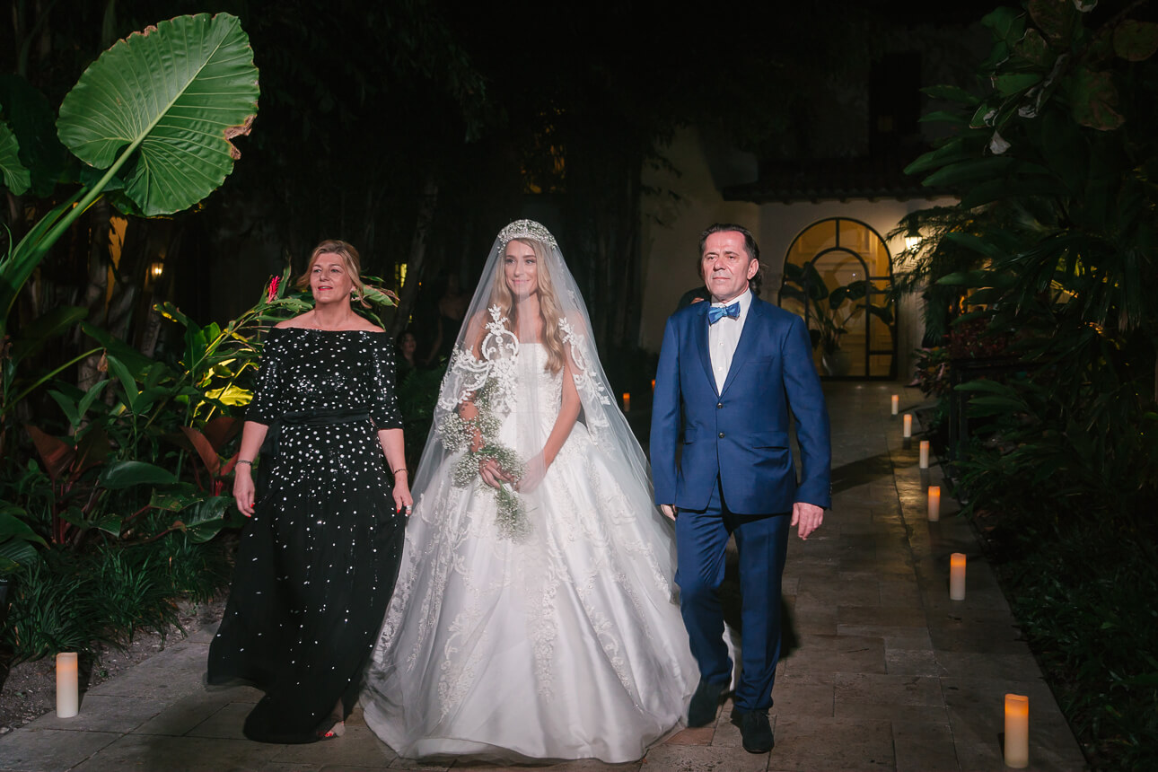 bride with her parents at Fisher Island Club Wedding