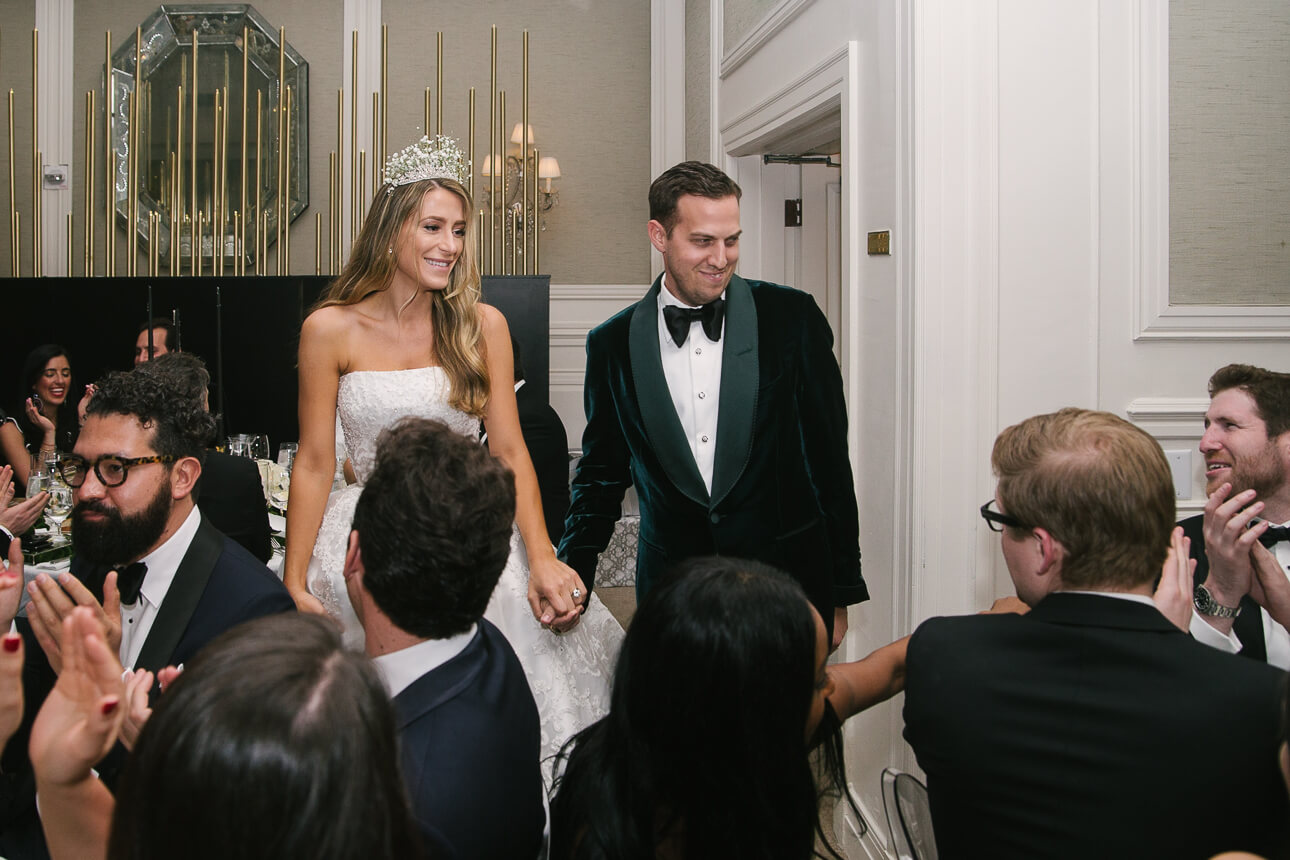 newlyweds entering Fisher Island Club Wedding dinner