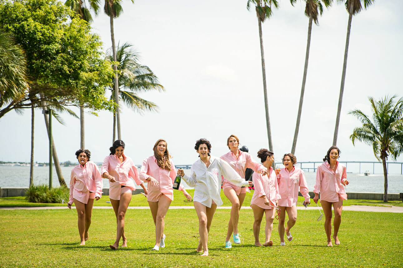 bride popping champagne at Mandarin Oriental Miami wedding