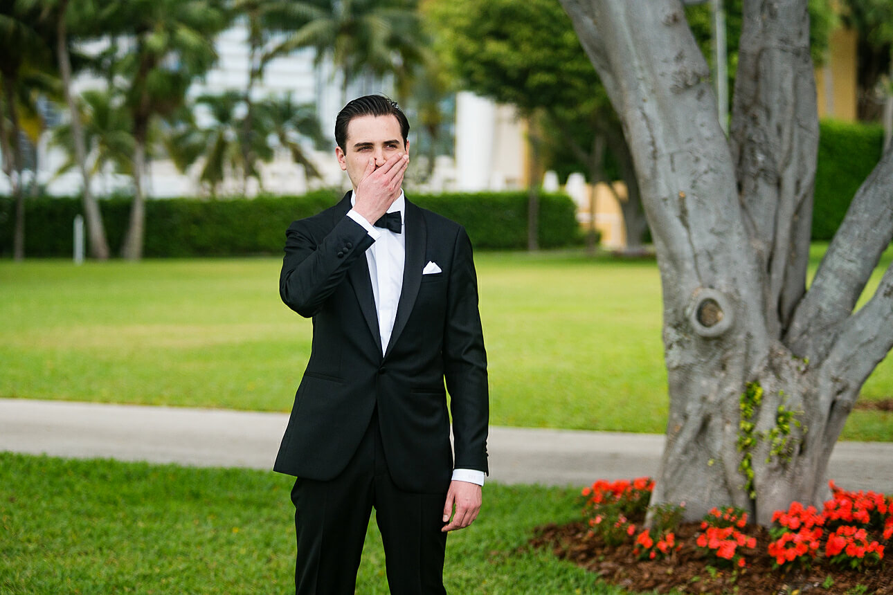 groom waiting for the first look